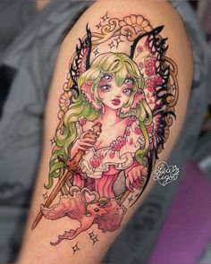 a girl with green hair holding a wand and stars on her arm is depicted in this tattoo design