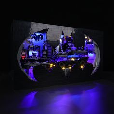 the batmobile is made out of legos and has blue lights on it's sides