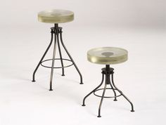 two metal stools sitting next to each other