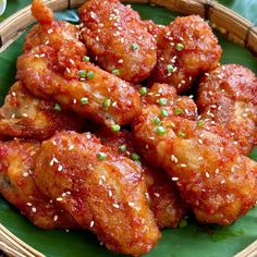 a close up of a plate of food with meat and sesame seeds on it's surface