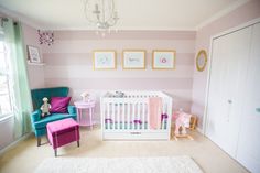 a baby's room with pink and blue furniture