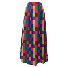 Brightly colored checker print skirt in lightweight, ultra soft silk. Banded waist with light pleating.Side Pockets. Hidden side zip closure. Maxi Length. Lined. In excellent condition. High-quality vintage pieces like this are yours to live in and love while increasing in value every year. It’s never too soon to start collecting them, as an investment in your wardrobe—and in yourself. Size estimate: S/M Measurements: Waist: 27.5" Hips: 42" Total Length: 39" Long Silk Skirt, Floor Length Maxi Skirt, Valentino Silk, Conservative Outfits, Vintage Designer Fashion, Black Velvet Skirt, Vintage Maxi Skirt, Checkered Skirt, Ankle Length Skirt