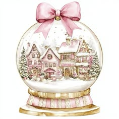 a christmas ornament with a pink bow and houses in the snow on it