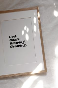 a white framed print with the words god, goals, growing on it