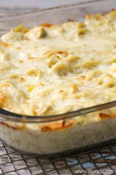 a casserole dish is sitting on a cooling rack and ready to be eaten