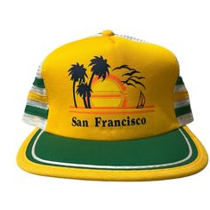 Vintage San Francisco Triangle Headwear One Size Flat Bill Snapback Trucker Hat This Vintage San Francisco Triangle Headwear One Size Flat Bill Snapback Trucker Hat Is A Must-Have For Any Fashion-Forward Man. The Yellow Color And Snap-Back Brand Make It A Unique Addition To Any Wardrobe. Made From A Blend Of Polyester And Cotton, This Hat Is Both Comfortable And Durable. It Features A One-Size-Fits-All Design, Making It A Great Gift For Any Man. The Hat Is Perfect For Any Occasion And Can Be Wor Trendy Yellow Trucker Hat For Spring, Retro Spring Baseball Cap For Outdoor, Green Summer Trucker Hat With Flat Brim, Trendy Yellow Snapback Hat With Curved Brim, Green Trucker Hat With Curved Brim For Travel, Green Flat Brim Trucker Hat For Summer, Yellow Trucker Hat One Size Fits Most, Casual Yellow Baseball Cap For Summer, Retro Snapback Hat For Outdoor Use In Spring