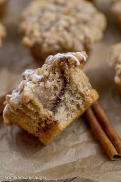 cinnamon muffins with two cinnamon sticks sticking out of them