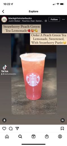 the starbucks app is showing an image of a drink in a plastic cup with strawberries on it