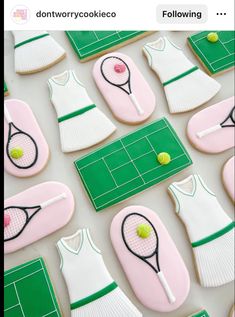 cookies decorated to look like tennis outfits and rackets are displayed on a white surface