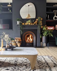 a living room filled with furniture and a fire place