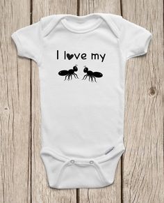 a white baby bodysuit that says i love my antelope on the front