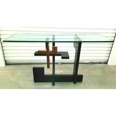 a glass table with a wooden cross on it