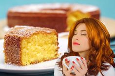 a woman is holding a cup and looking at a piece of cake on a plate