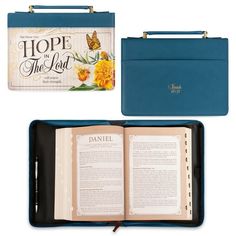 an open bible with a blue case next to it and a book on the cover