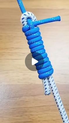 a blue and white rope attached to a wooden table