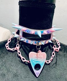 NEW Spike Pastelgoth Ouija Choker Handmade and Unique Pink and blue spikes Pink plastic chain and Ouija charm detail Pink satin tie closure Perfect for #goth #punk #pastelgoth #kawaii #cosplay Spiked Collar, Creepy Cute Fashion, Pastel Goth Outfits, Pastel Punk, Badass Outfit, Star Guardian, Goth Accessories, Pastel Goth Fashion, Kawaii Cosplay