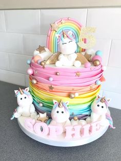 there is a cake decorated with unicorns and stars