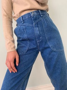 Vintage Wrangler jeans Love the big patch pocket details on the front and seam detail too. Good for a petite height (5ft 4" and under) Recommended size UK8. Waist 26". Inside leg 27". Bella is UK 8, she is 5ft 4.5" 100% cotton Colour : Mid blue denim wash Good vintage condition. Never worn, still has tags from the 90s!All pre-loved pieces have lived past lives, their imperfections are all part of their uniqueness and beautyMachine washable High Rise Medium Wash Jeans With Contrast Stitching, High Rise Cropped Jeans With Patch Pockets For Fall, Fall High Rise Cropped Jeans With Patch Pockets, Retro Mid-rise Jeans With Pockets, Retro High Waist Cargo Jeans With Pockets, Retro High-waist Cargo Jeans With Pockets, Retro Jeans With Pockets For Everyday, Retro High Waist Cargo Jeans, Cropped Leg Jeans With Patch Pockets