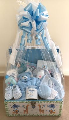 a baby boy gift basket filled with blue items