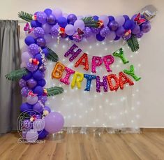 a birthday party with balloons and streamers