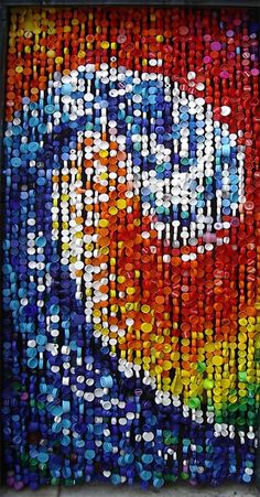 an image of a painting made out of bottle caps