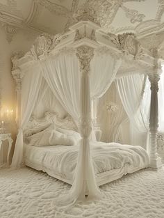 a white canopy bed sitting in a bedroom next to a chandelier and two tables