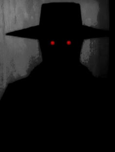 the silhouette of a man with red eyes wearing a hat and standing in front of a wall