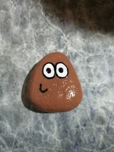 a rock with a face painted on it