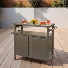 an outdoor kitchen cart with two trays on the top and food on the bottom