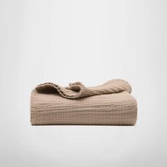 an image of a folded towel on a white background with room for text or images