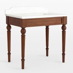 a wooden table with a white marble top