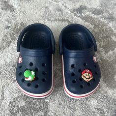 Dark Blue Toddler Crocs With Two Additional Mario Pins. Size 5. Like Brand New! Perfect As First Walking Shoes. Park Gunhoo, Crocs Outfit, Toddler Crocs, Crocs Crocband, Indian Aesthetic, Baby Boy Shoes, Baby Walker, Baby Outfits, Crocs Shoes