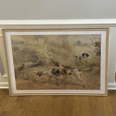 two dogs chasing each other in a painting