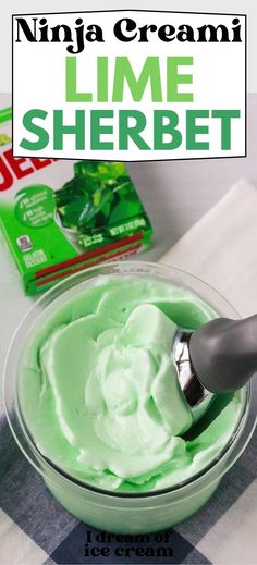 a bowl filled with green cream next to a box of ice cream and a spoon