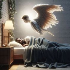 a man laying in bed next to an angel