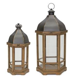 two wooden and glass lanterns with metal tops