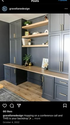 an office with gray cabinets and wood floors