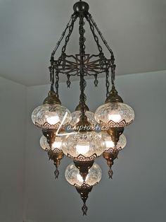 a chandelier hanging from the ceiling in a room