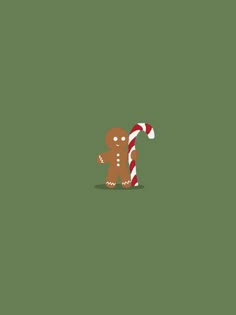 a gingerbread man holding a candy cane