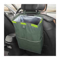 a car seat with a green bag in the passenger's side pocket and an air vent