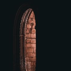 an arched window in the side of a building