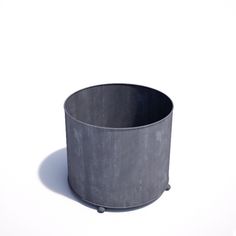 a round metal container sitting on top of a white surface