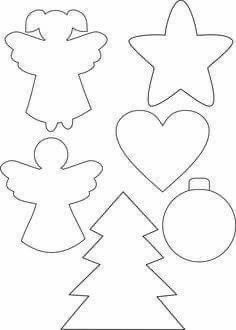 cut out christmas tree and ornaments for paper crafting with the shape of an angel