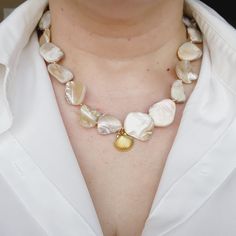 Maui Shelly Necklace has a ivory nacar chain with a shell charm and a toggle clasp. This is a unique and stunning necklace. The details of the pearls will give you a polish look. The baroque Pearls are that classic piece that goes with any trends. Combine Maui Shelly Necklace with Shelly Necklace. Material: Highly polished vacuum 18k Gold Plated & stainless steel for a refined metallic luster, better texture, lasting To Keep Colors! Necklaces come in a Pouch. Necklaces Details: Nacar Chain: 15 inches Stainless Steel & Gold Plated Water Resistance (remember to always clean your jewelry with clear water after you wear them to the pool or to the beach) Does not tarnish and with the right care it can last you for years. Check Our Jewelry Care Instructions. Fashion Tip: Add hops earrings or asy Aesthetic Pearl Necklace, Mother Pearl Necklace, Baroque Necklace, Ivory Necklace, Summer Jewelry Trends, Metallic Luster, Mother Of Pearl Necklace, Jewelry Care Instructions, Ivory Pearl