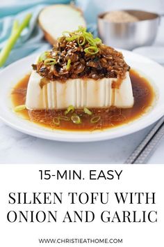 a white plate with food on it and text overlay that reads 15 min easy silken tofu with onion and garlic