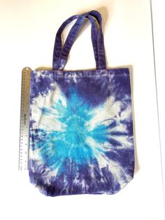 "Tie Dyed One of a Kind Canvas Bag in Bright Blue and Purple! These are 15.5X12.25. The handle is 7.5 inches long and 1\" wide. Fabric Content: 100% Cotton Washing: Can wash in the washer - with like colors." Large Blue Canvas Bag, Large Blue Everyday Bag, Large Blue Everyday Bags, Large Blue Shoulder Bag For Daily Use, Large Blue Bag For Everyday Use, Blue Cotton Tote Shoulder Bag, Large Blue Canvas Bag For Everyday Use, Everyday Hand Dyed Cotton Bags, Blue Cotton Bags For Daily Use