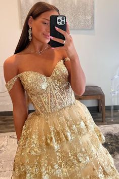 Make an unforgettable entrance in this eye-catching off-the-shoulder gold-sequin ruffle multi-layer long gown. Featuring exquisite gold-sequin lace, a deftly crafted lace-up back, and multiple layers of tulle for a luxurious effect, this showstopping dress is the perfect choice for any special occasion. Be the belle of the ball!

SKU: MD0575
Tulle Fabric
Floor Length
Size: US 0-26 W. Check our Size Chart to get your correct size. 
Recommend custom size for plus size.
Free custom size service is available. Email your exact measurements once order is placed. 
Fully lined & Built with bra
Processing time: 10-15 business days. 
If you want to speed up your dress processing time, please put in the link of rush order fee into your shopping cart to check out with the item you want. And email us t Off-shoulder Lace Party Gown, Glamorous Gold Strapless Gown, Gold Strapless Gown For Gala, Gold Lace Ball Gown Dress, Gold Strapless Gown For Prom Season, Gold Off-shoulder Gown For Wedding, Gold Ruffled Dress For Evening, Gold Off-shoulder Prom Dress, Gold Lace Floor-length Evening Dress