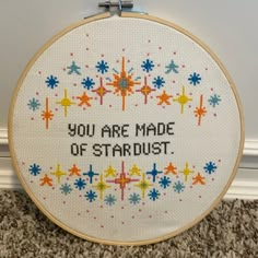 a cross stitch pattern with the words you are made of stardust