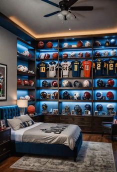 a football themed bedroom with blue lighting and built - in bookshelves for sports memorabilia