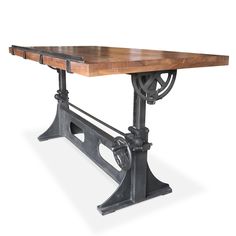 an old fashioned wooden table with metal legs and wheels on the top, against a white background